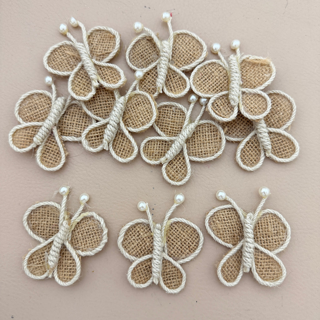 Pack of 5 Handmade Jute Burlap Butterfly Patches on beige background