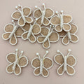 Pack of 5 Handmade Jute Burlap Butterfly Patches on beige background