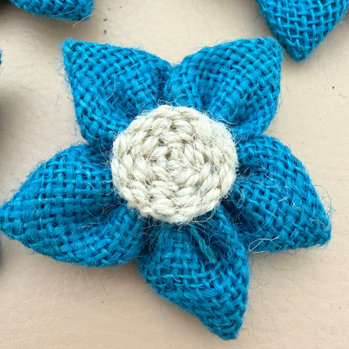 Close-up of blue jute burlap flower patch showing rope spiral centre detail