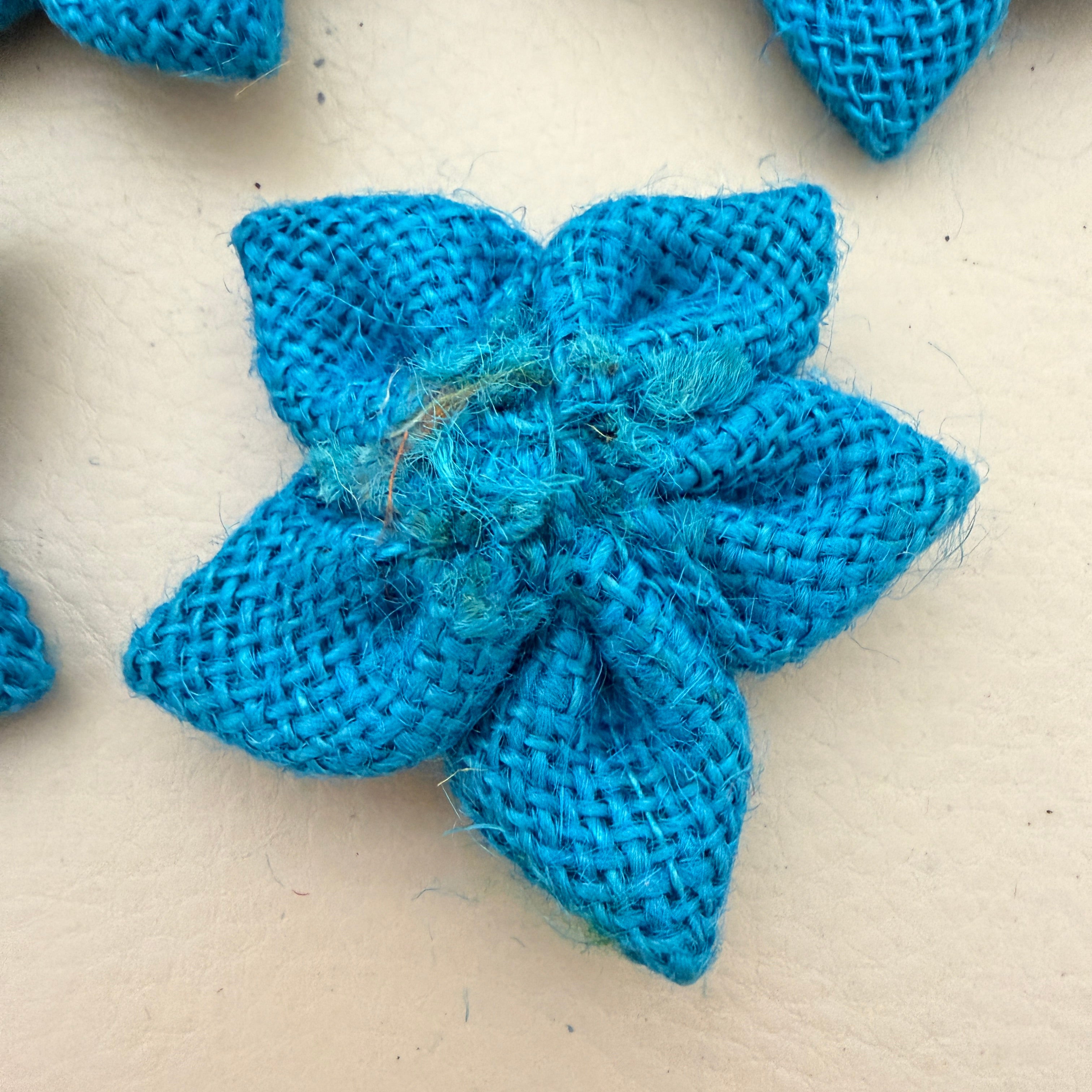 Back view of blue jute burlap flower patch showing neat finish