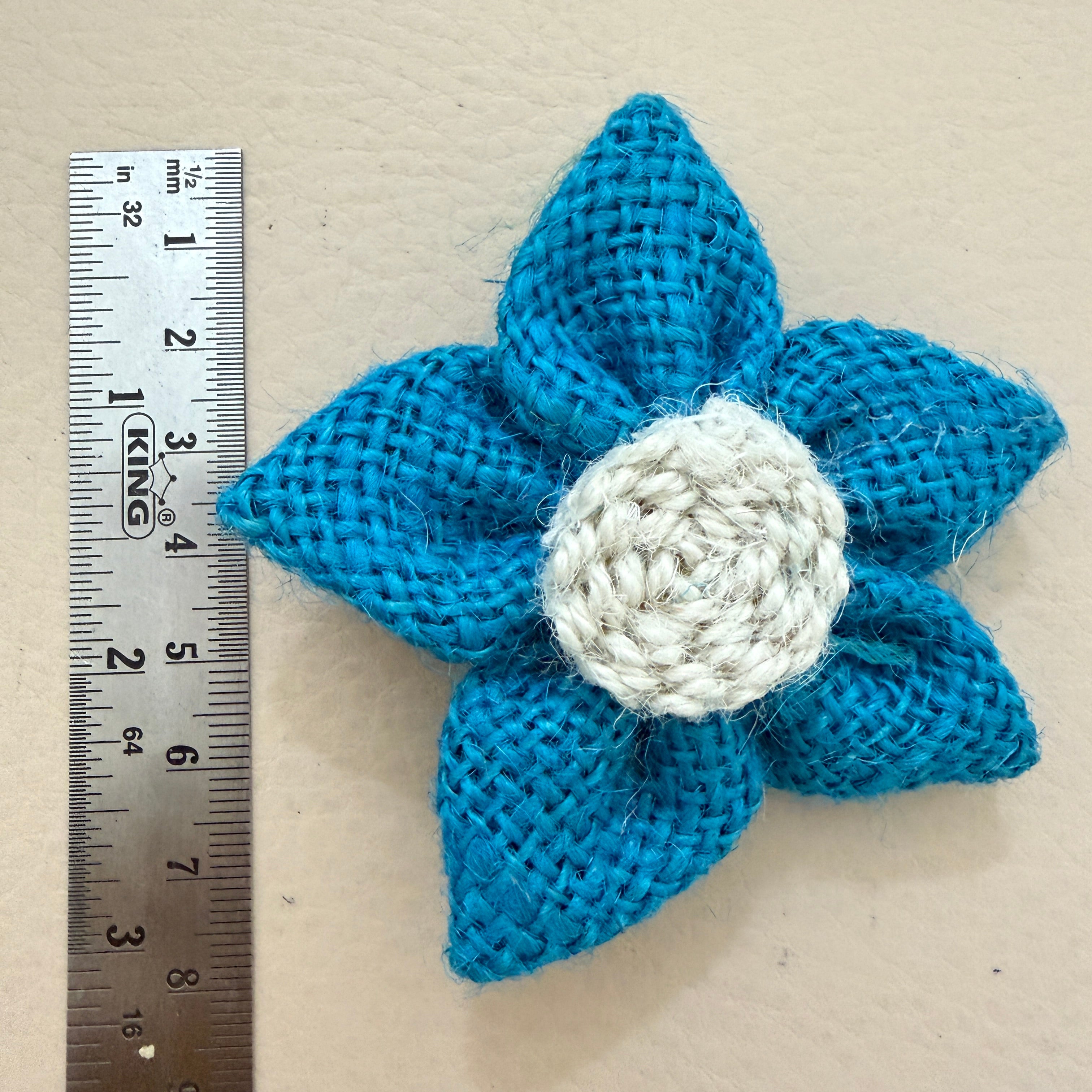 Blue jute burlap flower patch with ruler showing approx 6-7cm diameter