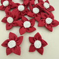 Pack of red jute burlap flower patches spread on beige background