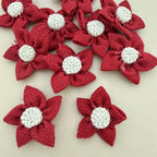 Pack of red jute burlap flower patches spread on beige background
