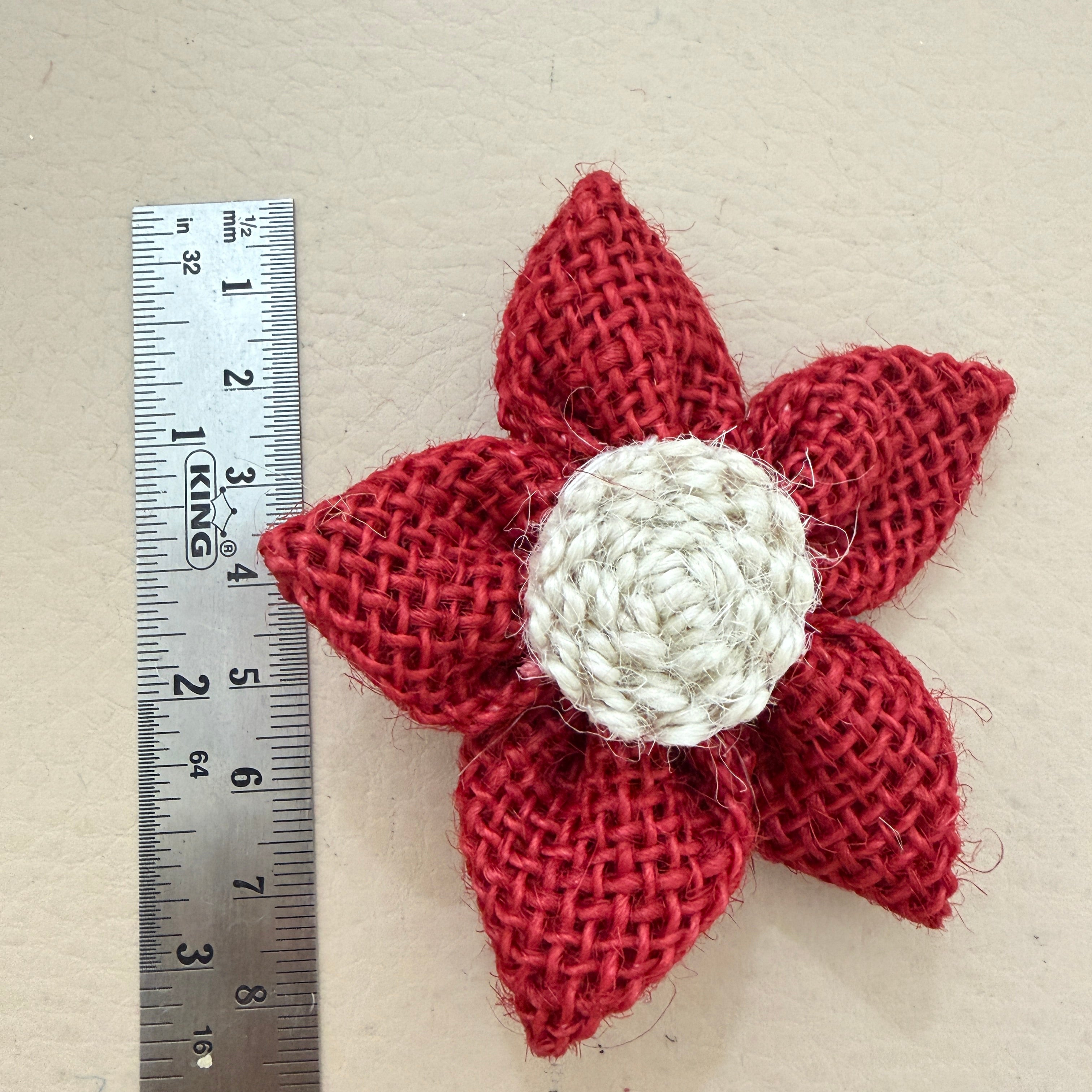 Red jute burlap flower patch with ruler showing approx 6-7cm diameter