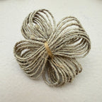 Back view of jute twine flower patch showing neat tied finish