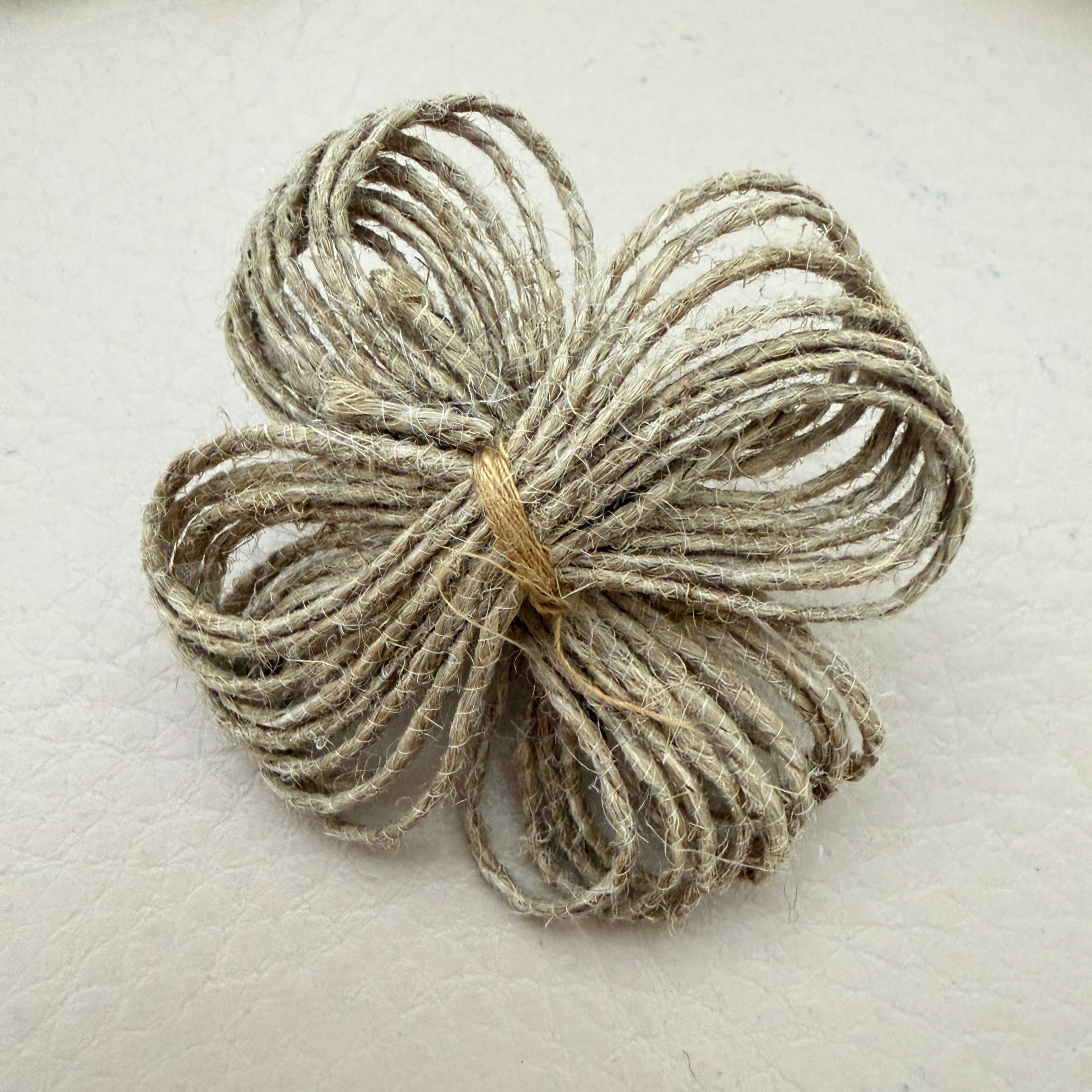 Back view of jute twine flower patch showing neat tied finish