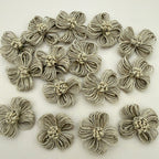 Pack of handmade jute twine flower patches spread on white background