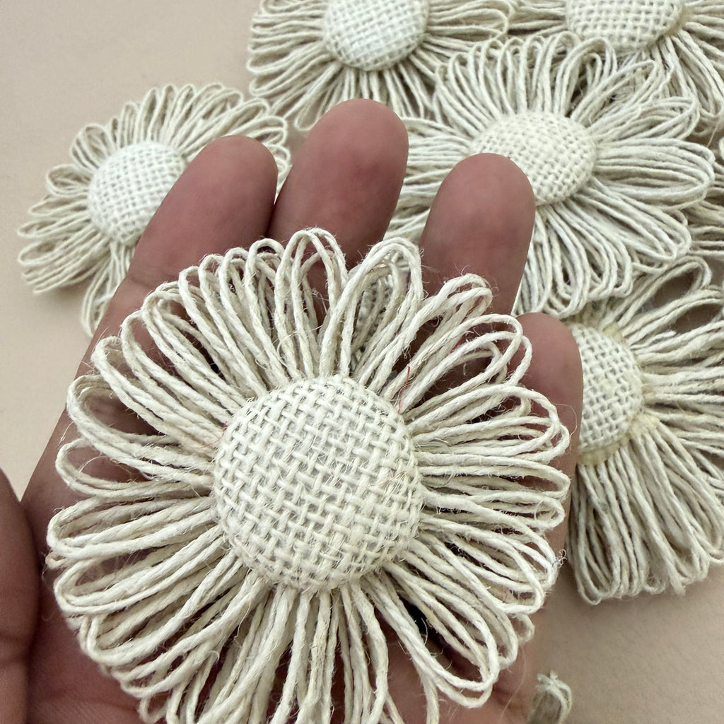 Jute twine daisy flower patch held in hand showing size