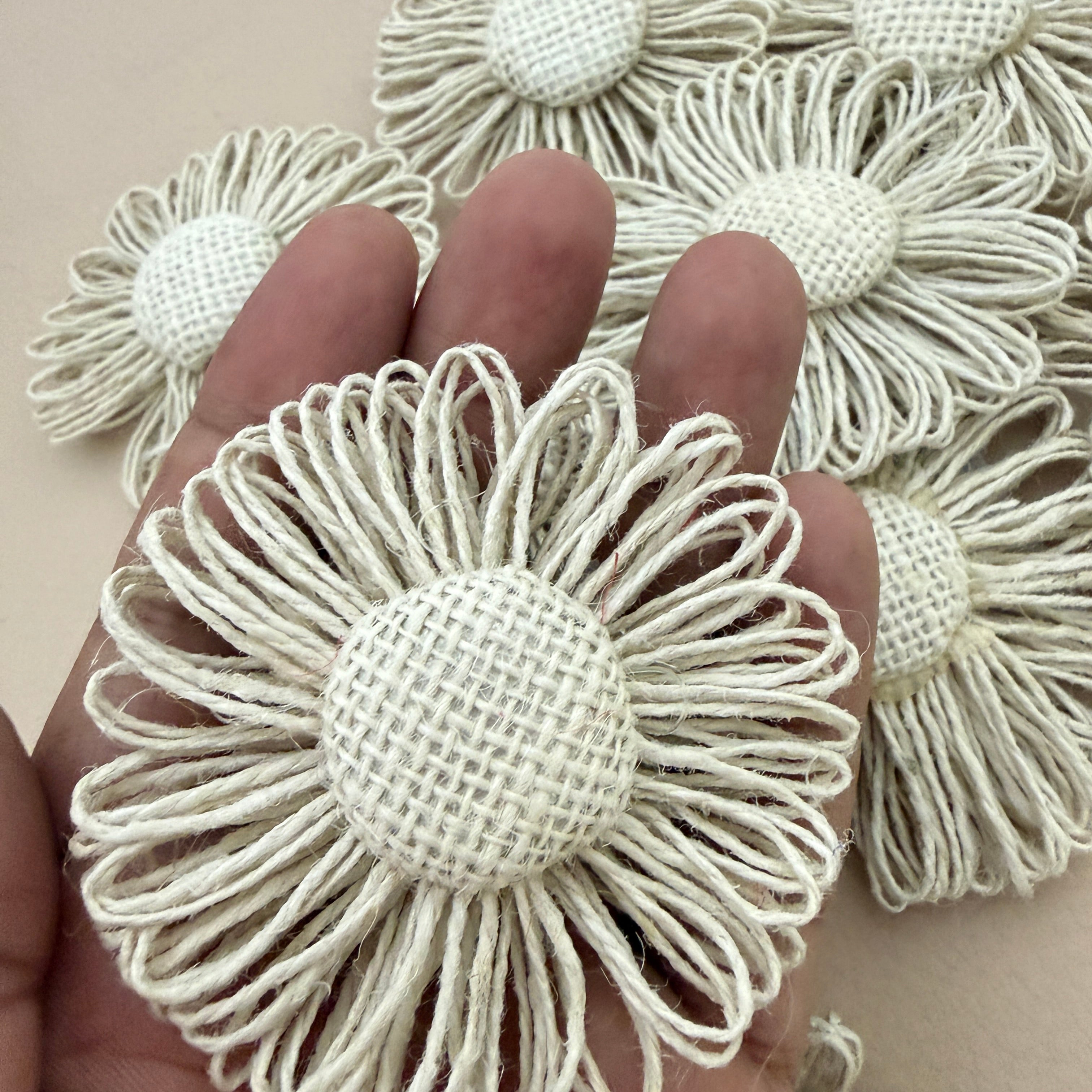 Jute twine daisy flower patch held in hand showing size