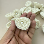 Jute rope rosette patch held in hand showing size and front detail