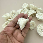 Back view of jute rope rosette patch held in hand