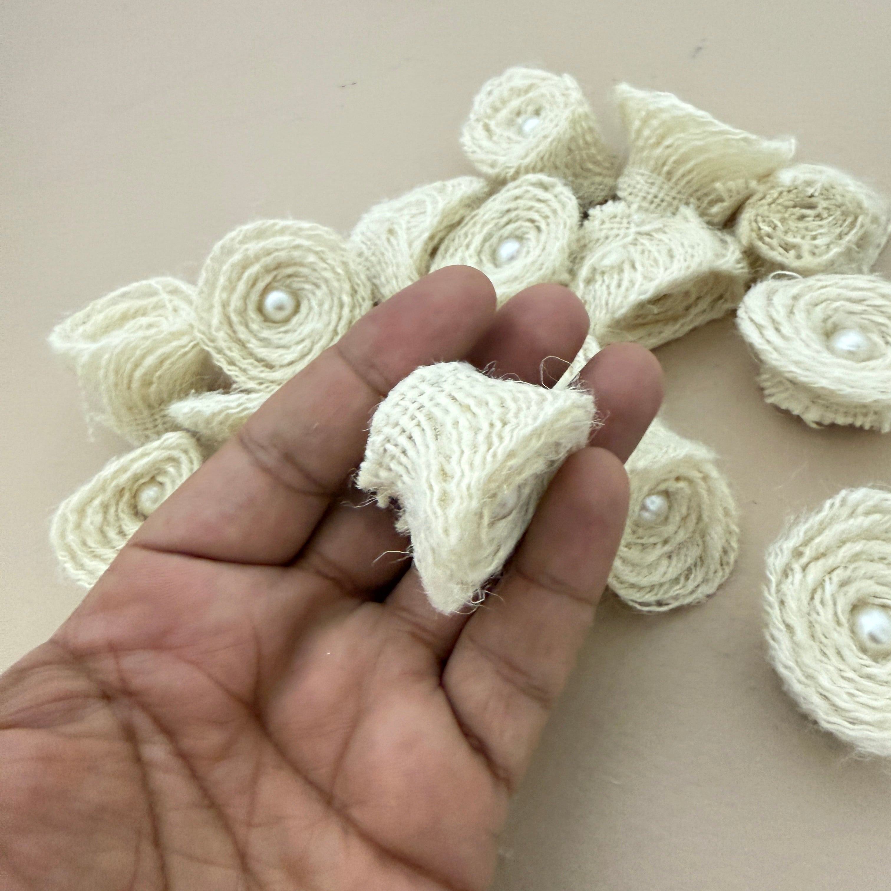 Back view of jute rope rosette patch held in hand