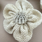 Close-up of single 3D puffed burlap flower patch showing twisted rope rosette centre