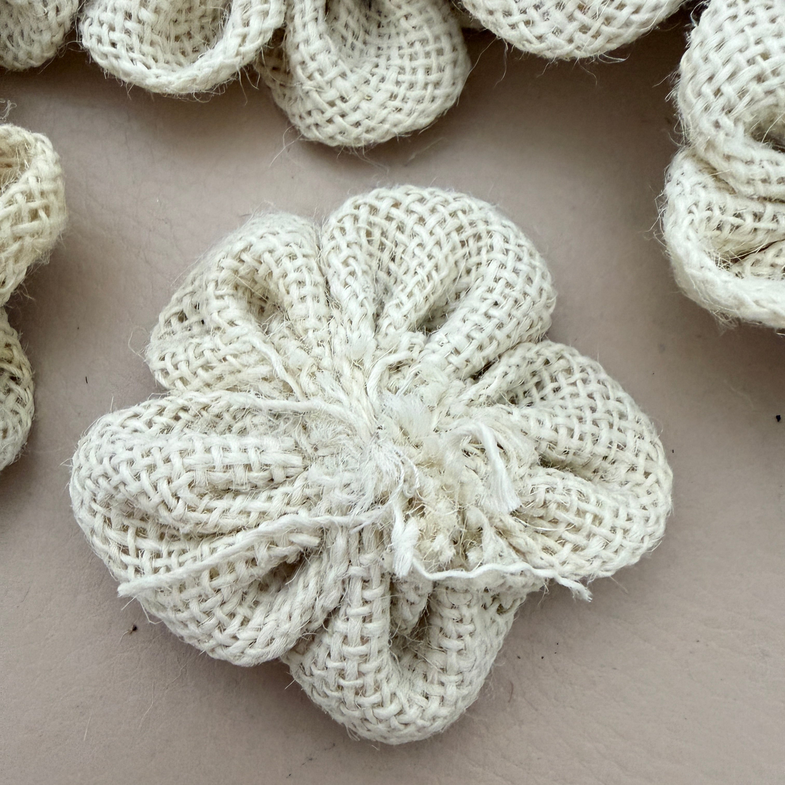 Back view of 3D puffed burlap flower patch showing neat tied finish