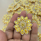 10 yellow floral patches arranged in a circle