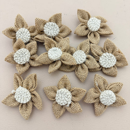 Single handmade jute burlap flower patch with ruler showing 7cm size