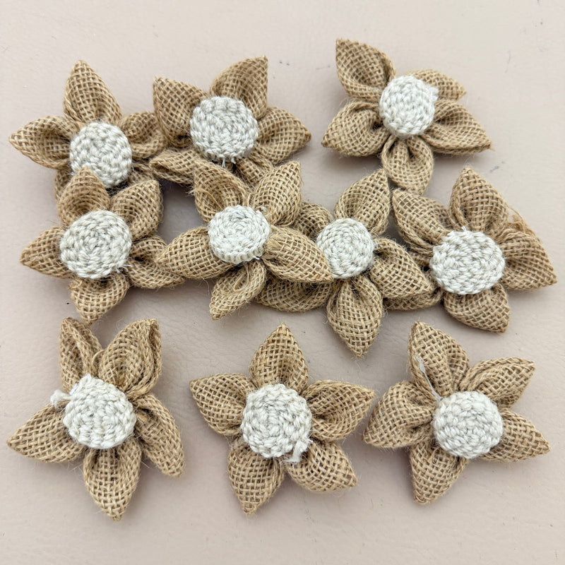 Single handmade jute burlap flower patch with ruler showing 7cm size