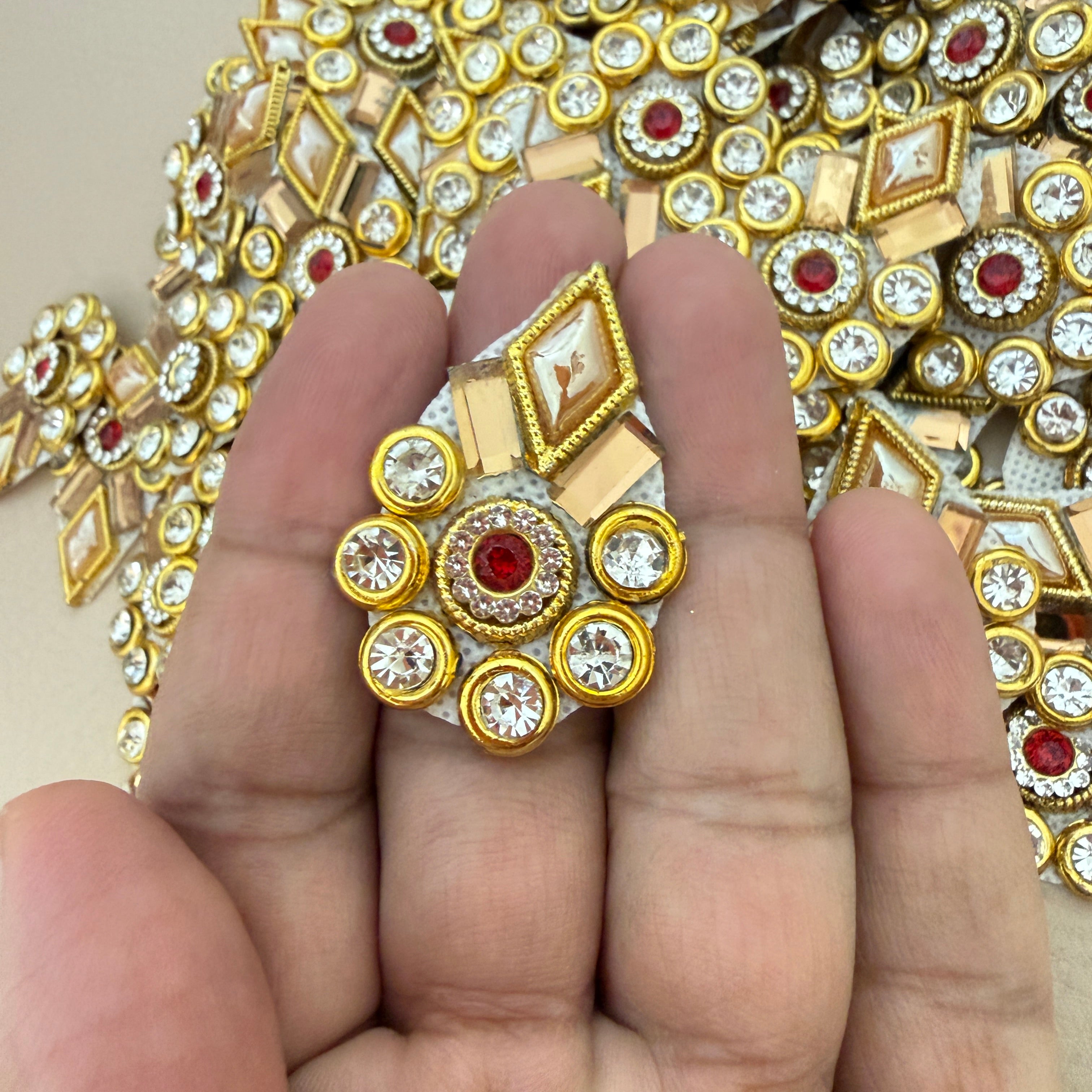 Front and back view of gold rhinestone patch showing mesh backing