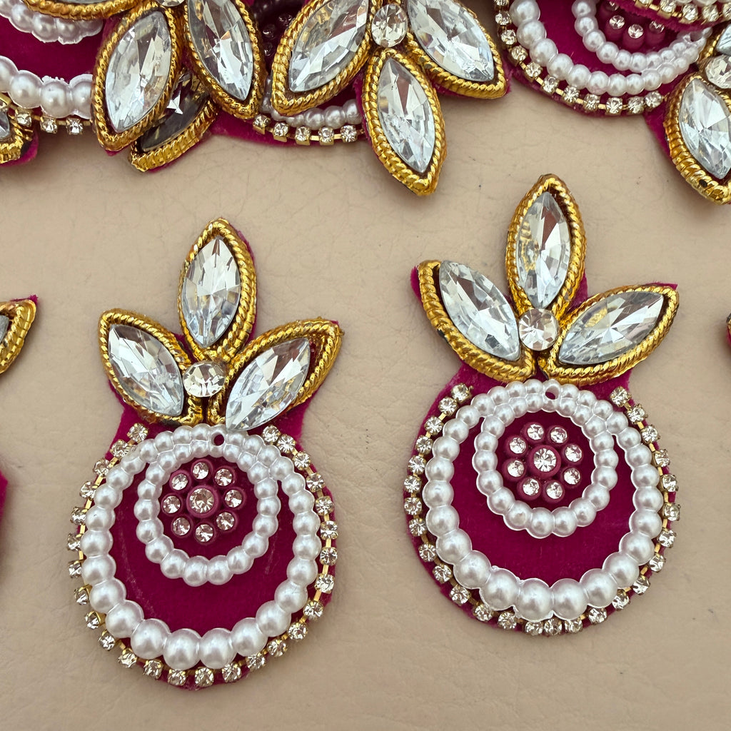 Maroon pearl crystal patch with ruler for size reference