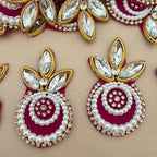 Maroon pearl crystal patch with ruler for size reference