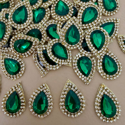 Emerald green teardrop rhinestone patches arranged in a circle – top view