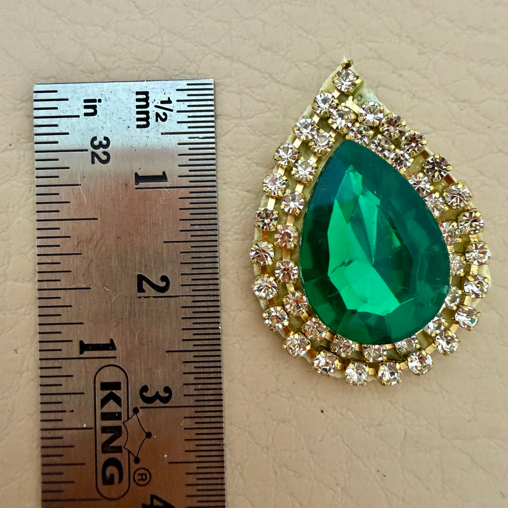 Patch held in hand showing size reference