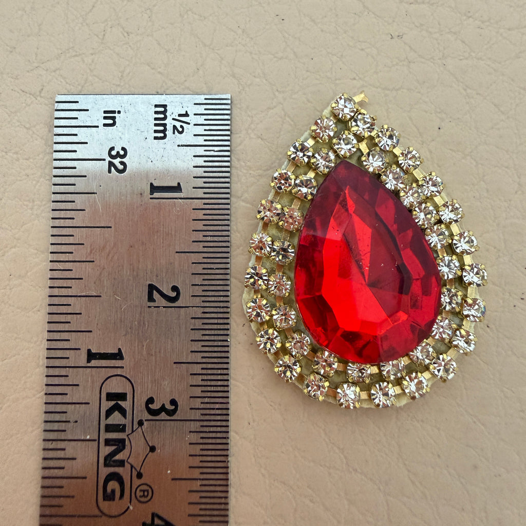 Single red teardrop patch with ruler – approx 3.5cm size reference
