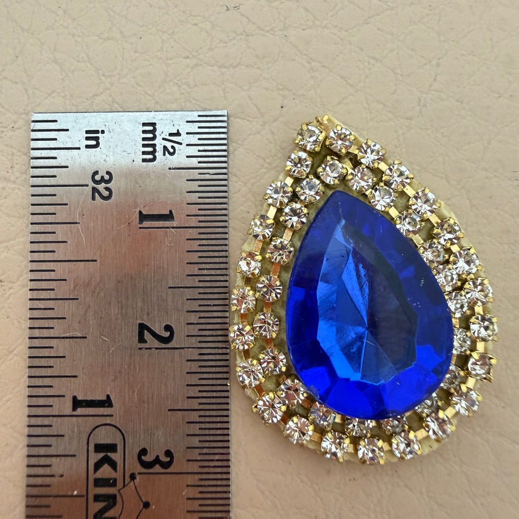 Royal blue teardrop patch with ruler – approx 4cm size reference