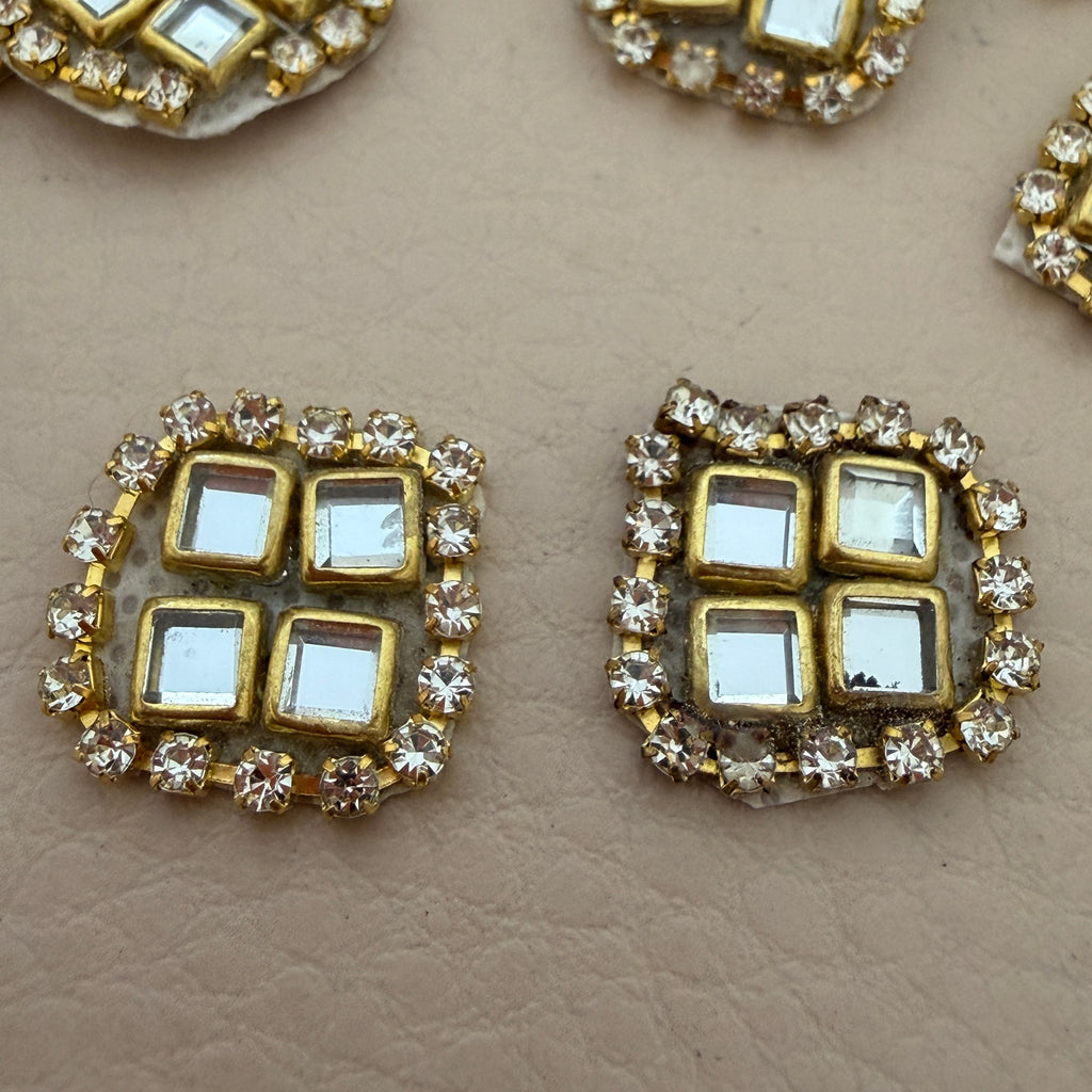 Close-up of kundan rhinestone patches showing front detail