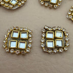 Close-up of kundan rhinestone patches showing front detail
