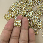 Kundan mirror patch held in hand showing actual size