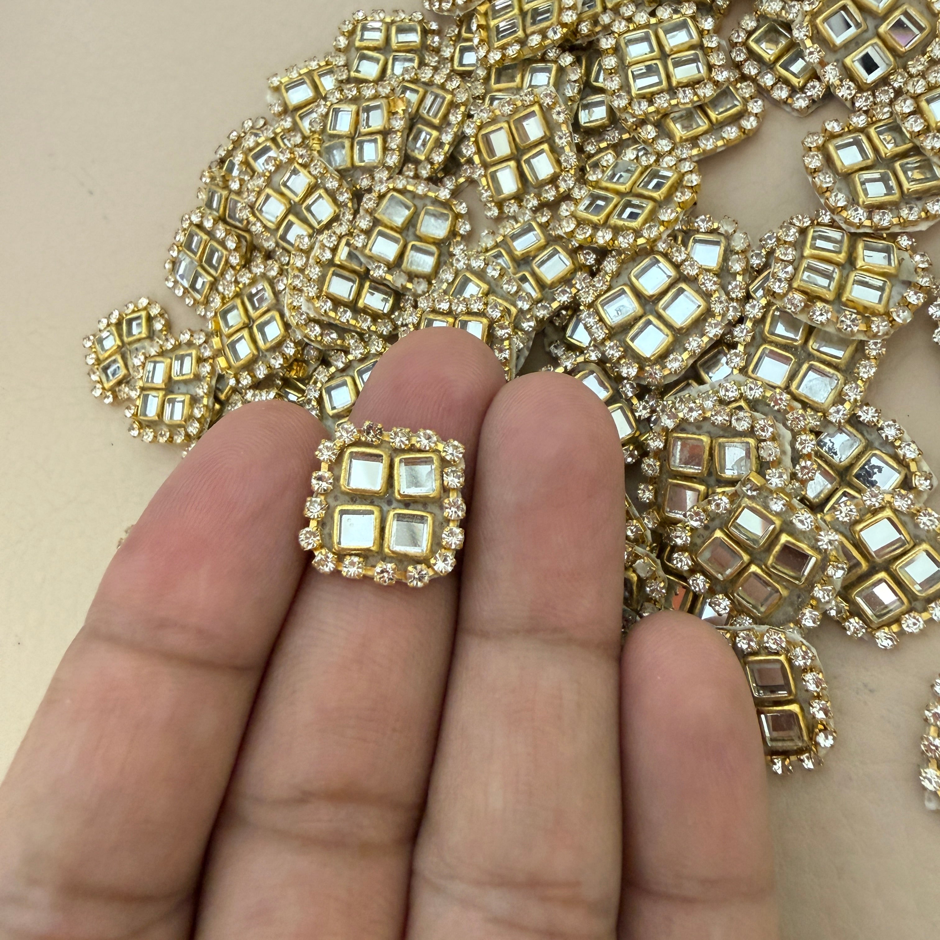Kundan mirror patch held in hand showing actual size