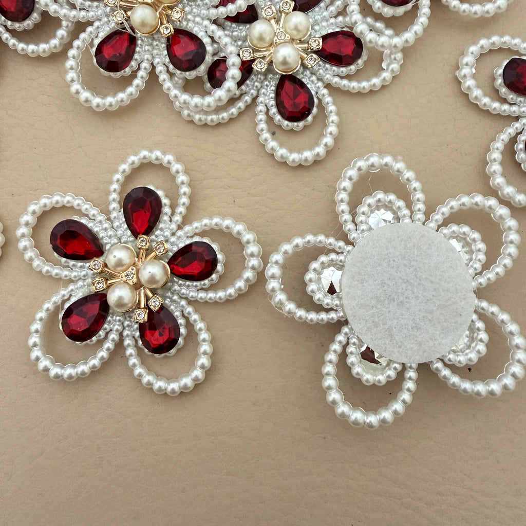 Red crystal pearl flower patch with ruler for size reference