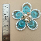 Blue crystal pearl flower patches – bulk lot view