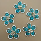 Blue crystal pearl flower patch held in hand showing scale