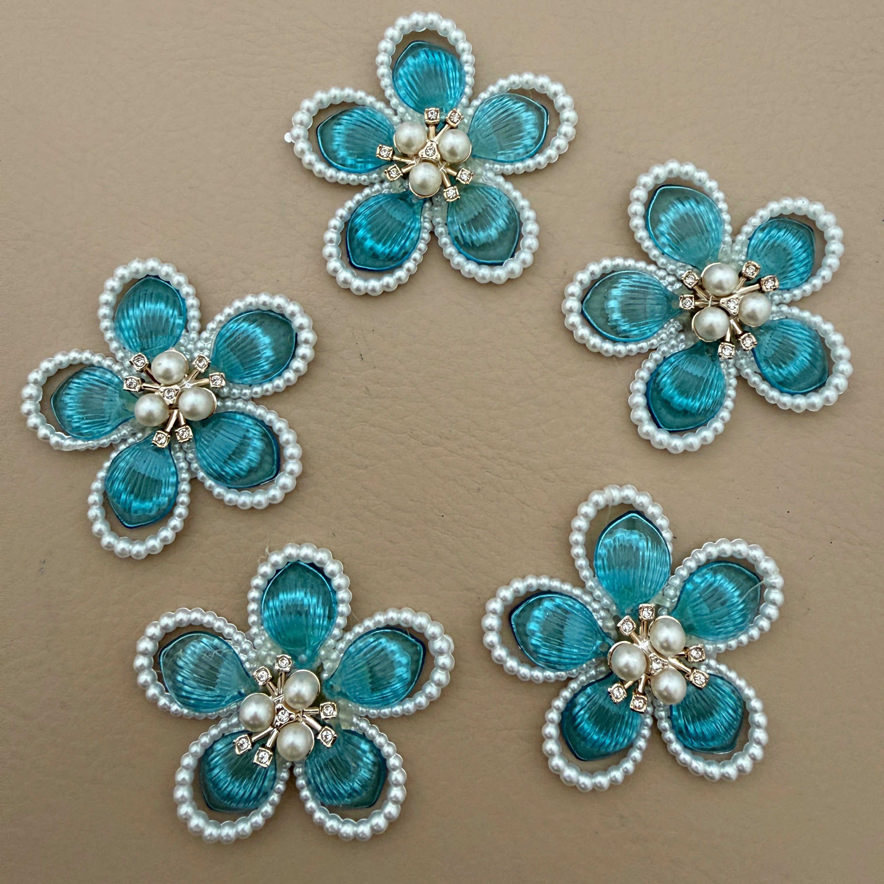 Blue crystal pearl flower patch held in hand showing scale