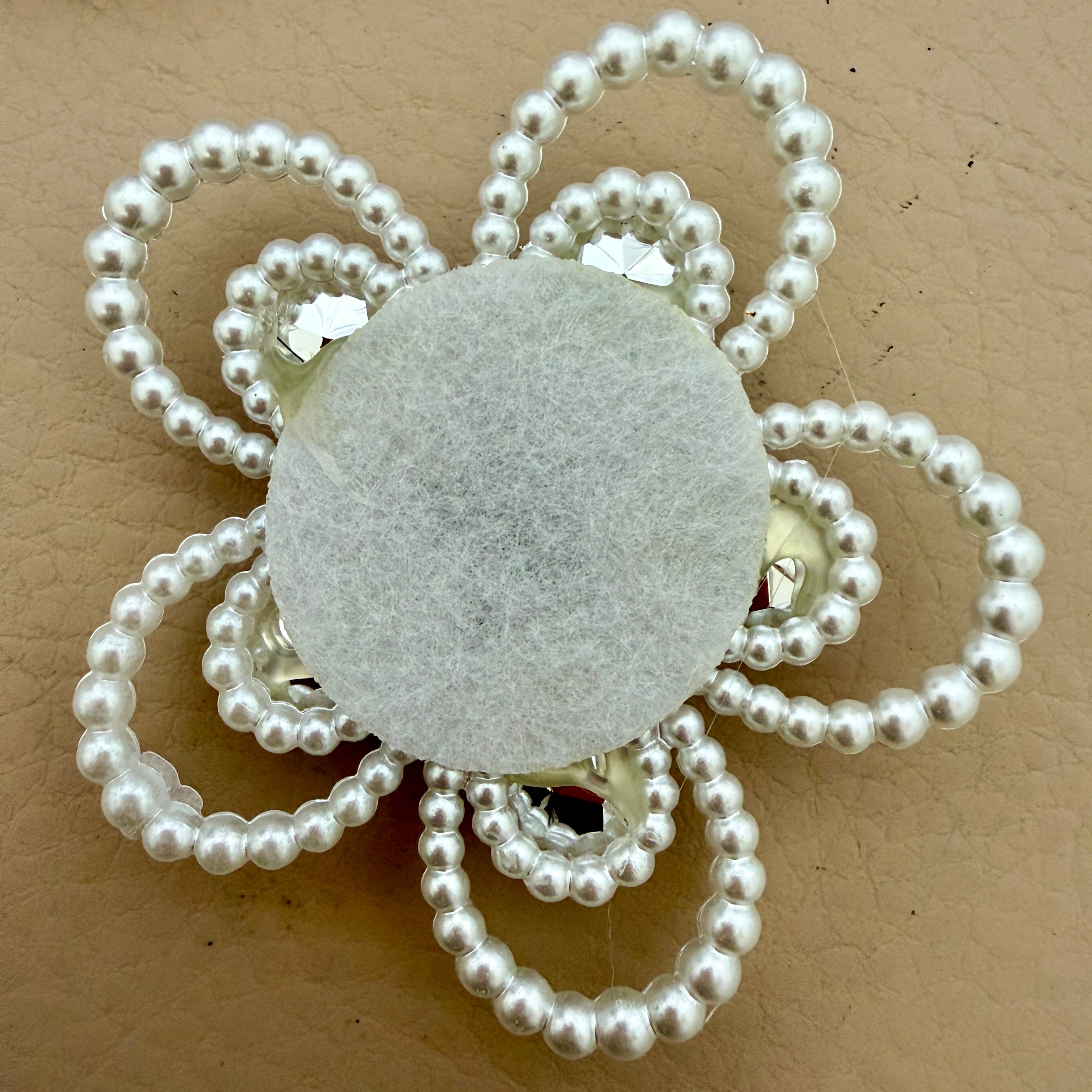 Fuchsia crystal pearl flower patch – back view showing grey felt base