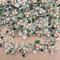 Green speckle pearl rhinestone flower patches – bulk lot overhead view