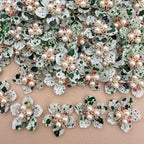 Green speckle pearl rhinestone flower patches – bulk lot overhead view