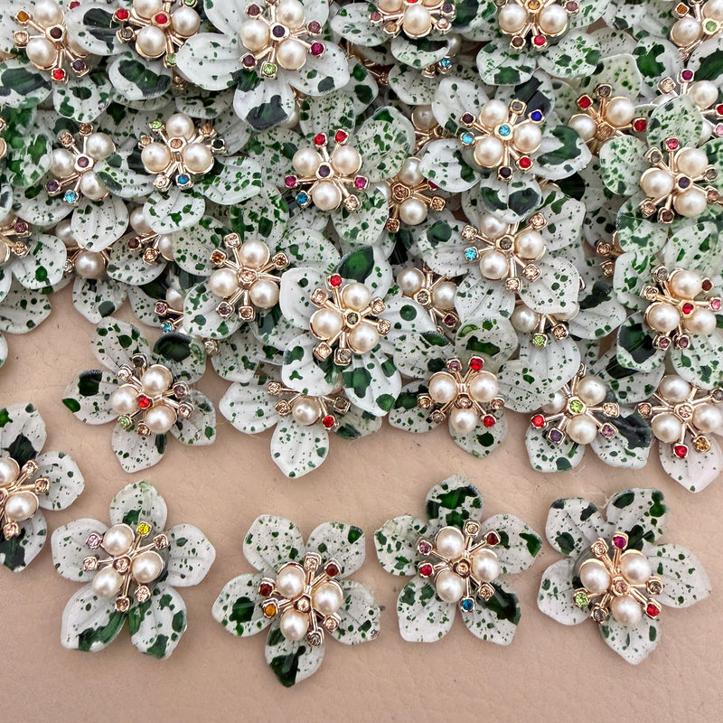 Green speckle pearl rhinestone flower patches – bulk lot overhead view