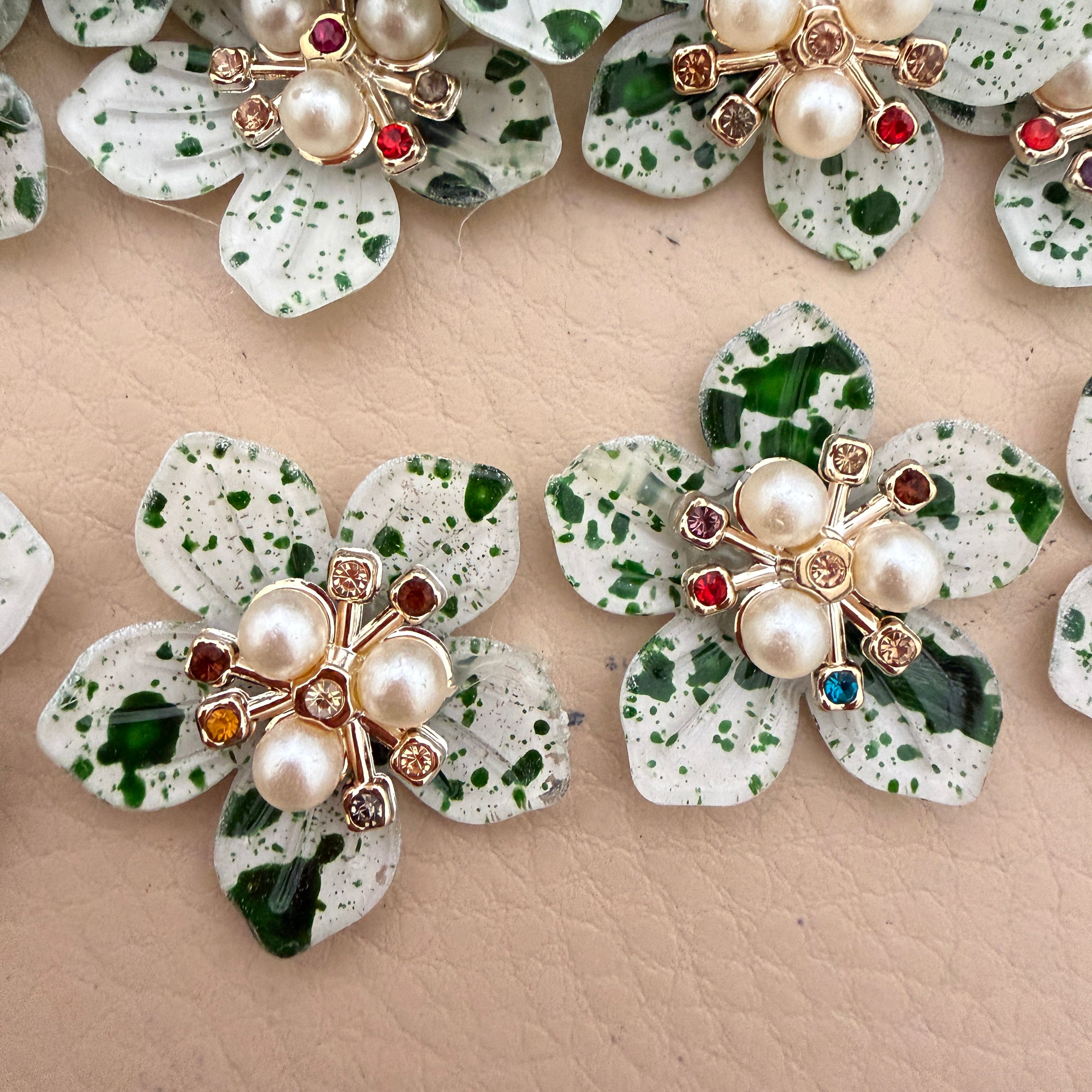 Green speckle pearl rhinestone flower patches – close up showing multicolour rhinestone centres