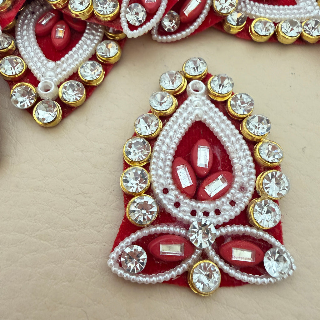 Close-up detail of pearl bead outline and crystal cup-chain border