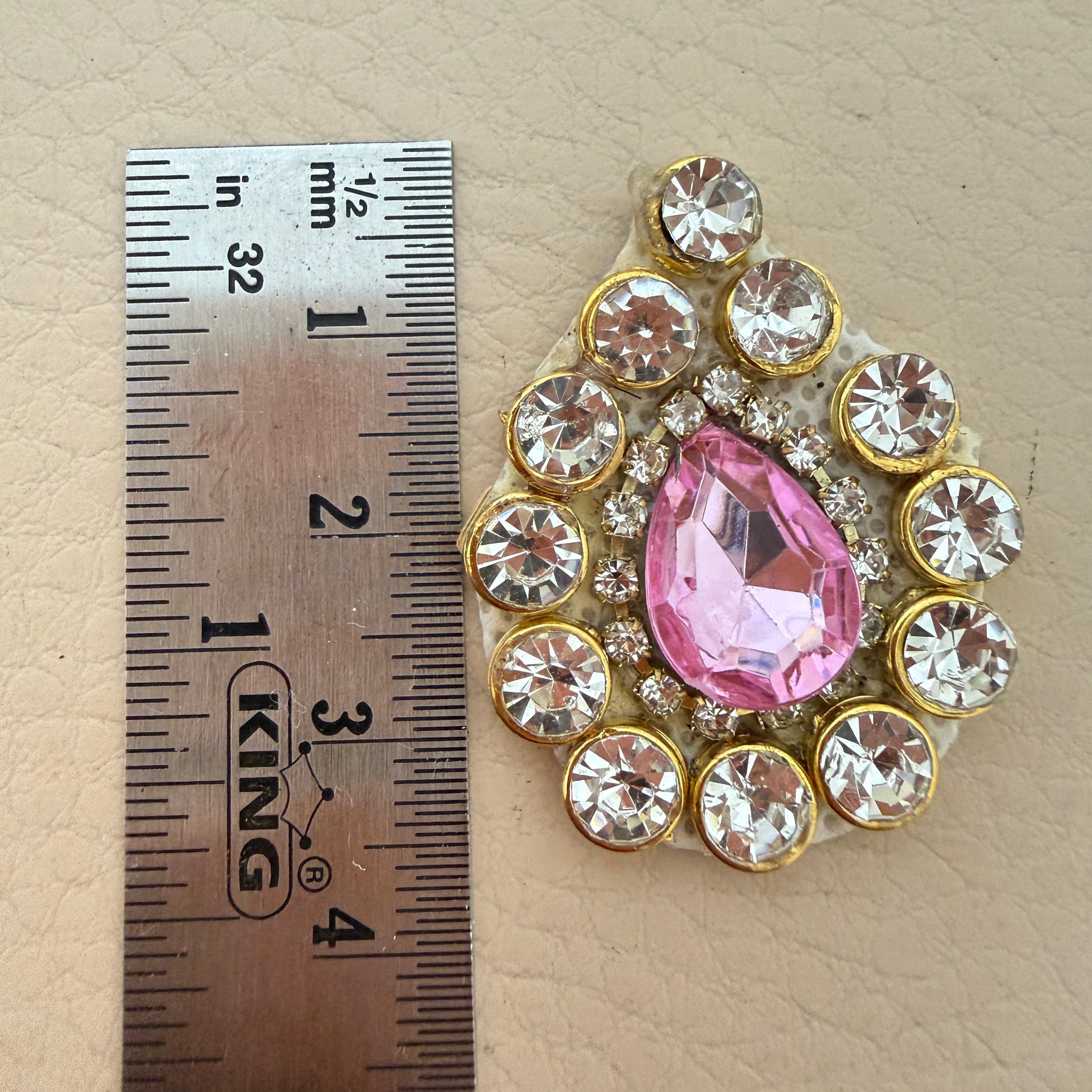 Pink rhinestone crystal patch with ruler showing approx 4cm x 3cm size