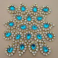 Aqua blue rhinestone crystal patches arranged in star pattern