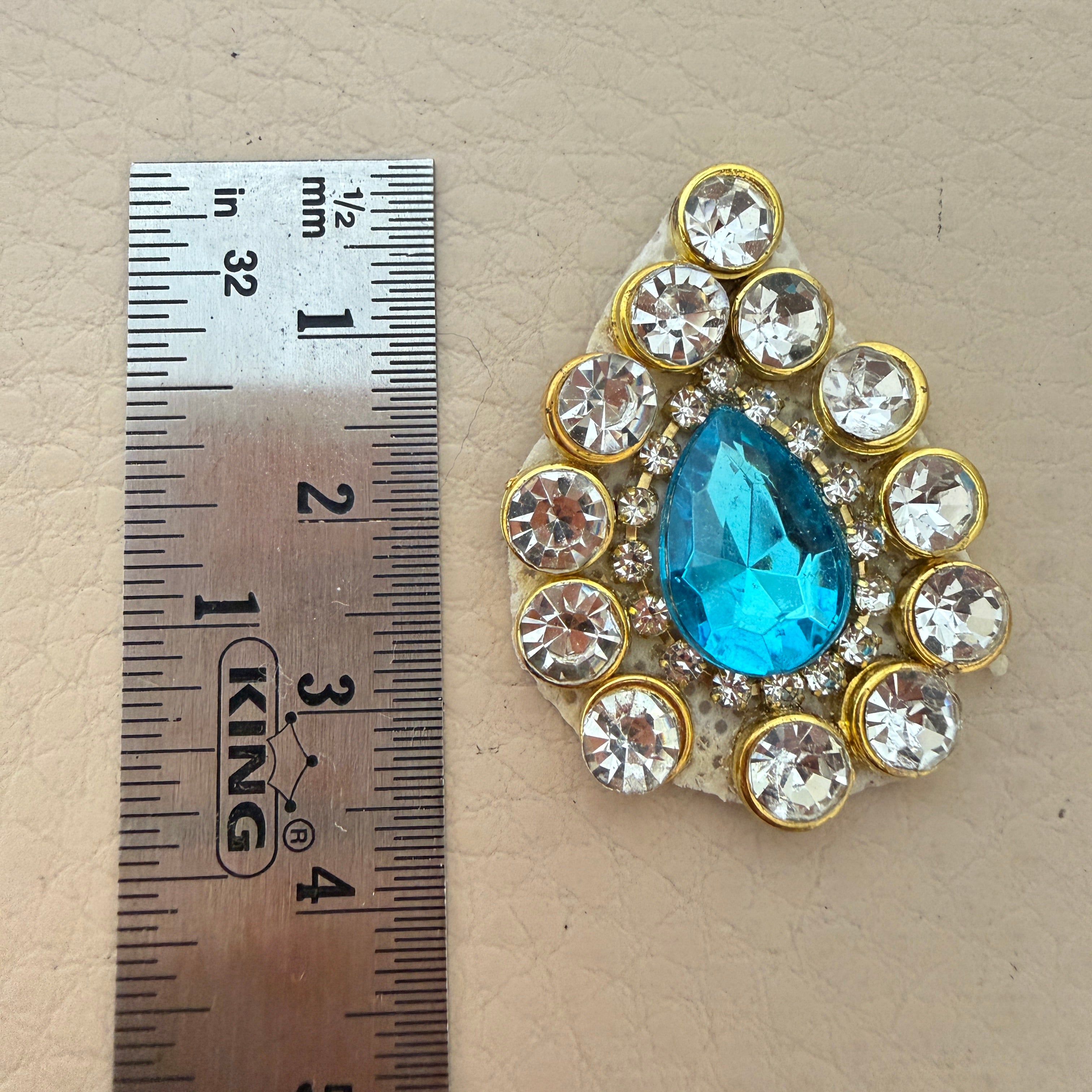 Aqua blue rhinestone crystal patch with ruler showing approx 4cm x 3.5cm size