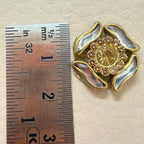 25 antique gold rhinestone flower motif patches arranged in a circle