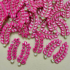 Hot pink rhinestone leaf motif patch shown next to ruler – approx 10cm length