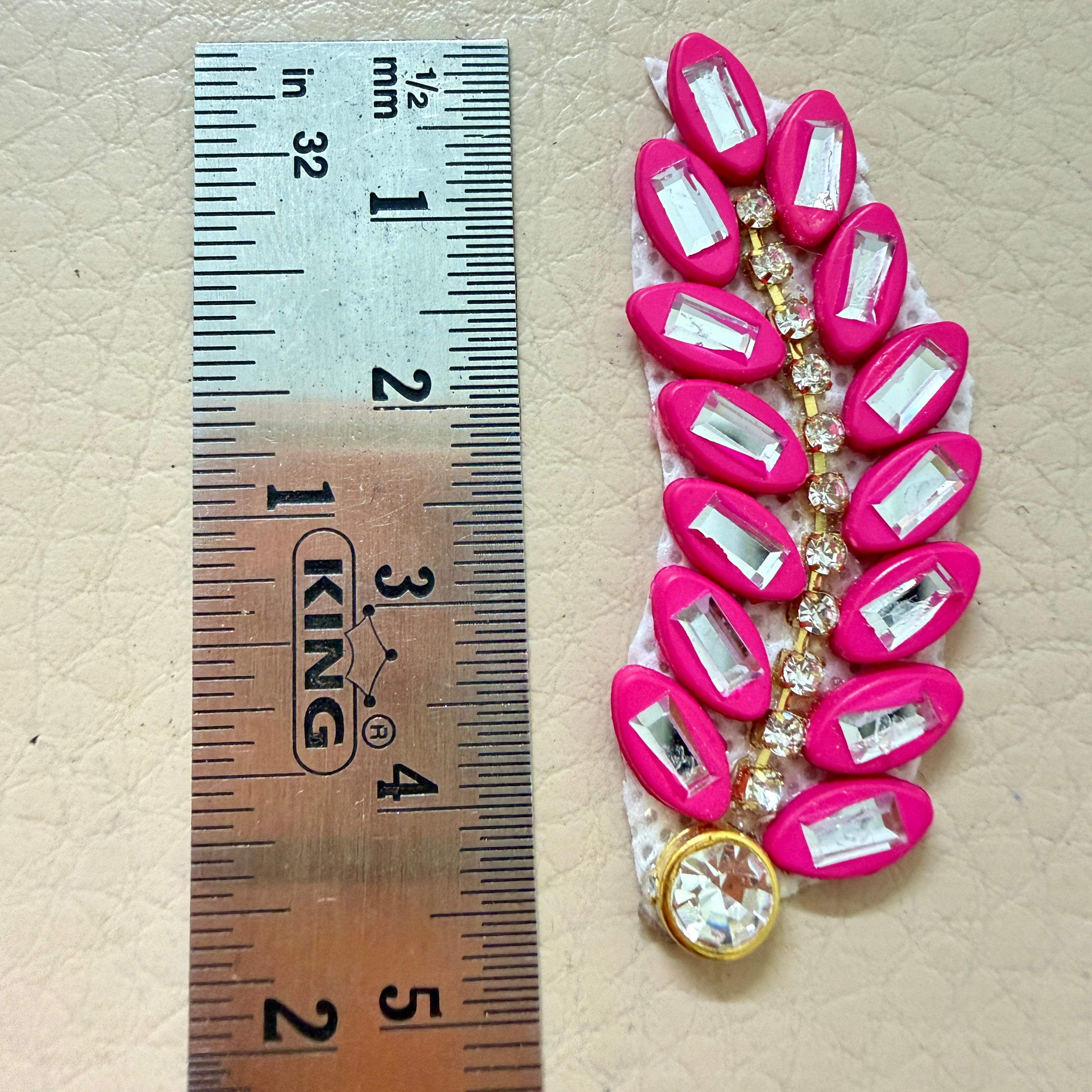 9 hot pink rhinestone leaf motif patches laid flat showing front detail