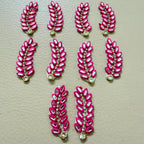 Bulk lot of hot pink rhinestone leaf motif patches spread out