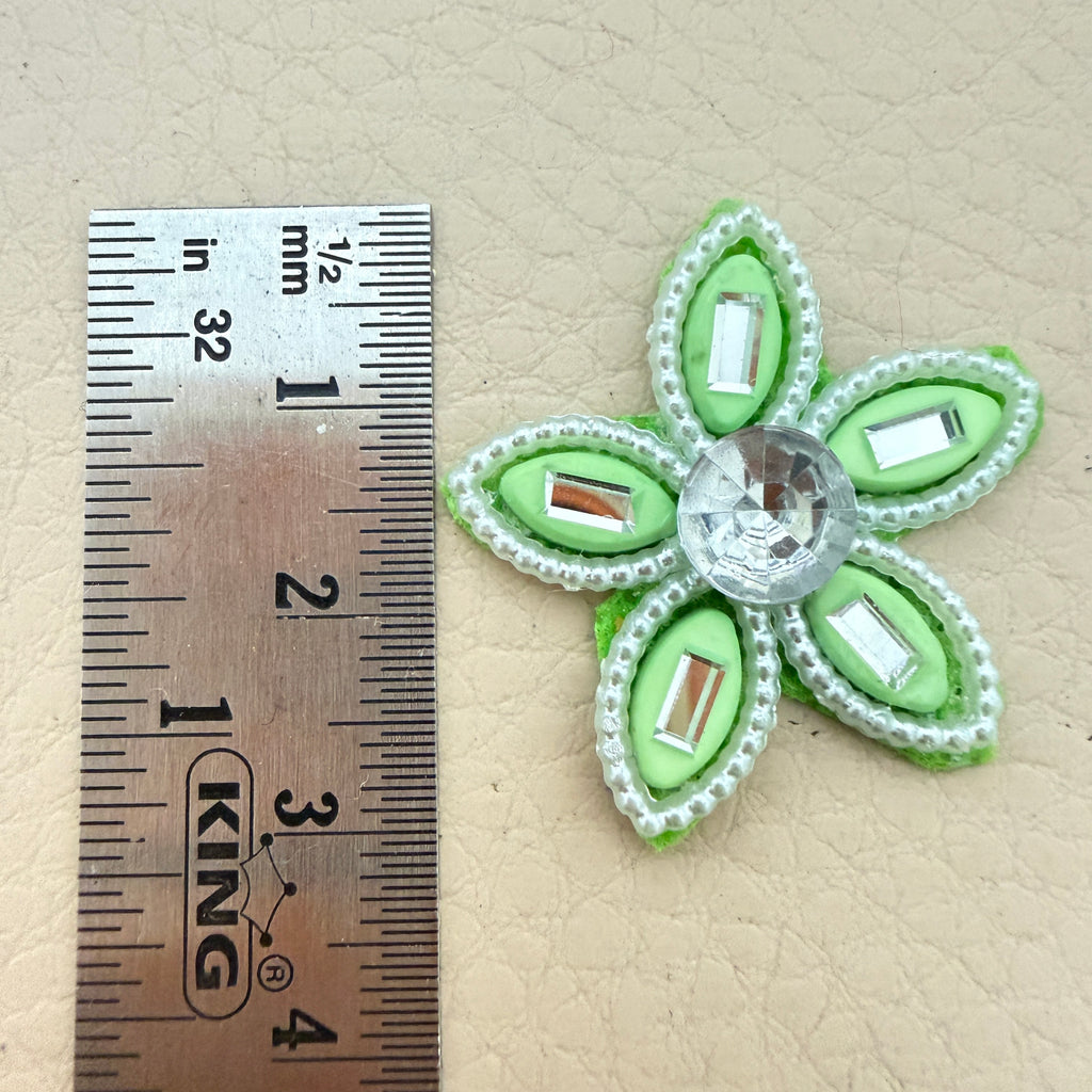 Mint green rhinestone flower motif patch next to ruler showing approx 3.5cm size